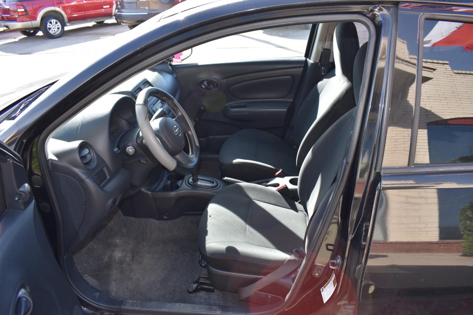 2014 Black /Black Nissan Versa 1.6 S 5M (3N1CN7AP2EL) with an 1.6L L4 DOHC 16V engine, CVT transmission, located at 5925 E. BELKNAP ST., HALTOM CITY, TX, 76117, (817) 834-4222, 32.803799, -97.259003 - The 2014 Nissan Versa 1.6 S 5M offers several benefits, including its fuel efficiency, spacious interior, and affordable price tag. It's also known for its reliability and low maintenance costs, making it a practical choice for budget-conscious buyers. Additionally, its simple yet functional design - Photo#6